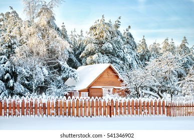 Winter morning in Russian village with snow covered trees. Colorful outdoor scene celebration concept