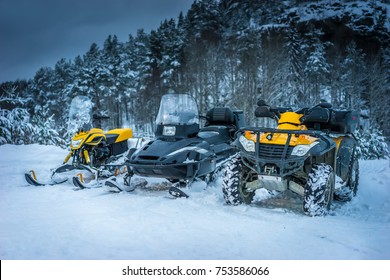 Winter Motorcycle. Snowmobile. Winter ATVs. Winter ATVs in winter against the backdrop of the mountain.