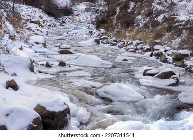 Winter Mountain River. Frozen Banks Of A Mountain River.