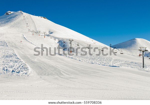Winter
mountains background with ski slopes and ski lifts. Skiing resort.
Extreme sport. Active holiday. Free time
concept.