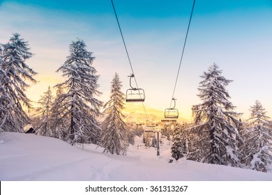 Winter mountains panorama with ski slopes and ski lifts near Vogel ski center, Slovenia - Powered by Shutterstock