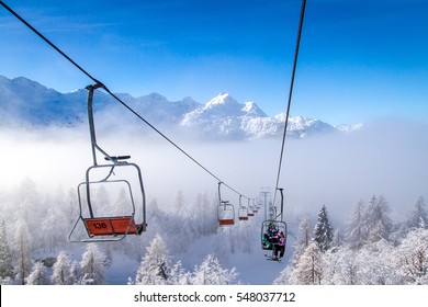 Winter mountains panorama with ski slopes and ski lifts at Vogel ski center, Slovenia.