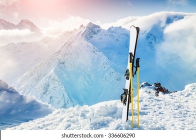 Winter mountains and ski equipment in the snow. Skiing, ski resort, winter holidays. - Powered by Shutterstock