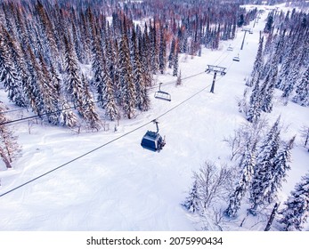 Winter Mountains With Ski Lifts And Snowy Forest, Aerial Top View.