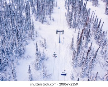 Winter Mountains With Ski Lifts And Snowy Forest, Aerial Top View.