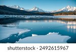 Winter mountains at sunrise. Amazing snowy nature landscape in sunlight. Scenery mountain clean icy lake in the morning. 