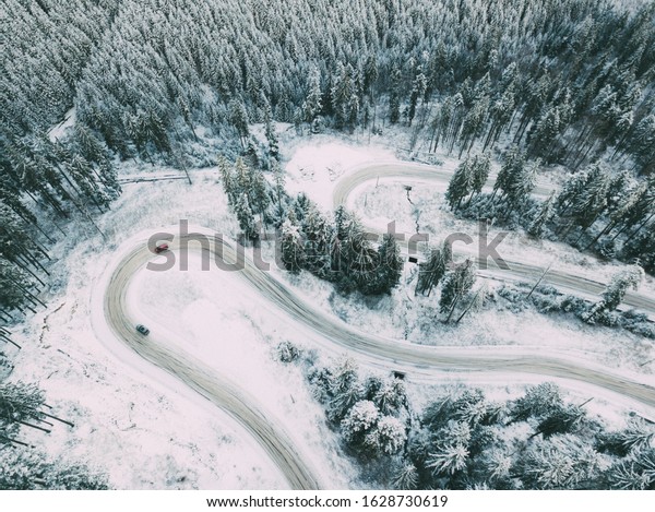 Winter moutain road. Aerial view. Location:\
Rarau Mountains,\
Romania.