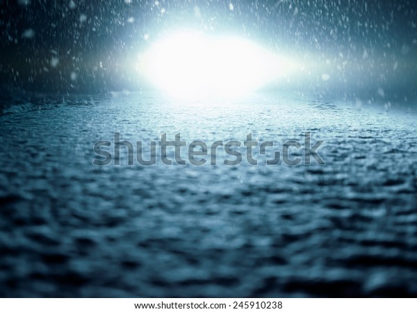 Winter Night Driving - Winter Road\
- Abstract winter background - Snow covered road at\
night.