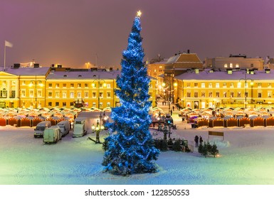 Winter Night Scenery Of Senate Square With Christmas Tree And Holiday Market In Helsinki, Finland