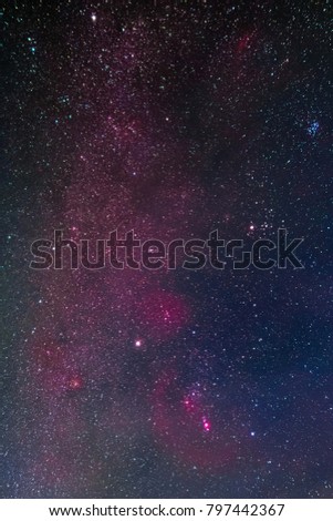 Winter night sky including Barnard’s Loop, the Orion Nebula, the Flame Nebula, the Rosette Nebula, the California Nebula, and the Pleiades as seen from Battenberg in the Palatinate Forest in Germany.