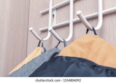 Winter Outerwear, Coat Hanging On A Hook Of A Coat Rack In Hallway, Anteroom At Home.