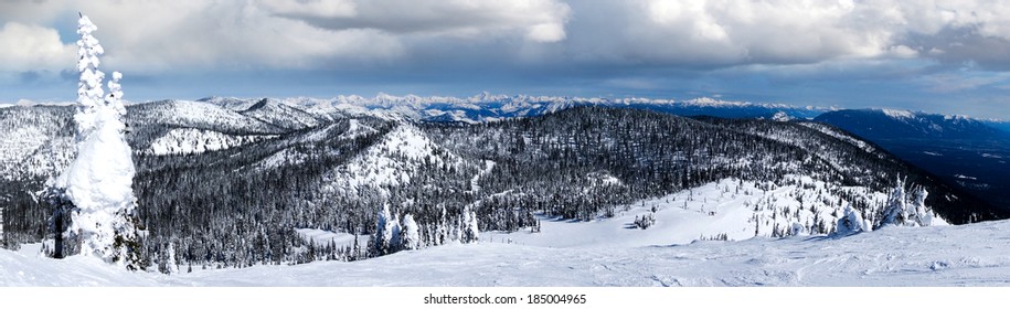 Winter panorama of Big Mountain in Whitefish, Montana, USA, with Glacier National Park in the background.