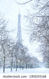 Winter In Paris, Eiffel Tower Coverd With Snow. France