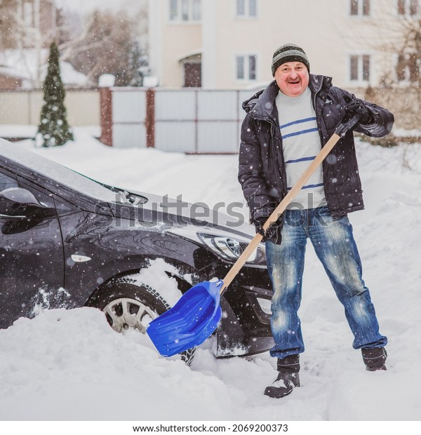 Winter, people and car problem concept. Man stuck\
in the snow. Mutual aid. Winter problem. transportation, winter and\
transportation concept