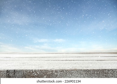 Winter Photo Of Blue Sky With Snow And Frost Decoration On Table 