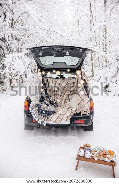 Winter Picnic Set Up in Car. Snow Forest Picnic.\
Love Story in Nature