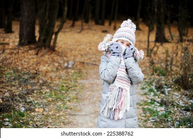 Winter Portrait Of Adorable Happy Child Cold  Girl In Warm Hat And Scarf