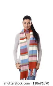Winter portrait of attractive young woman in long scarf.