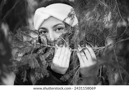 Similar – a girl with long hair and blue eyes in the mountain covering her face with her hair