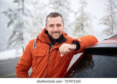 Winter Portrait Of A Man With A Car.