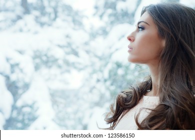 Winter Portrait Of Young Woman By Window