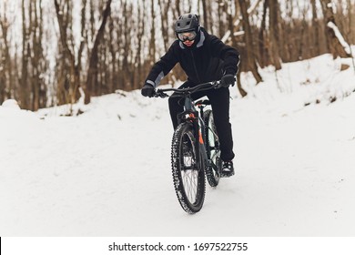 Winter riding a mountain bike in the forest. - Powered by Shutterstock