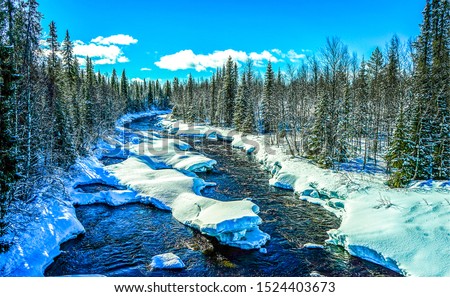 Winter river in snow forest landscape view