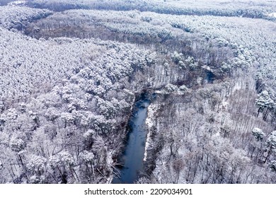 Winter River And Snowy Forest. Aerial View Of Winter In Poland, Europe