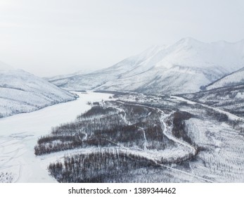 Winter road along the Kolyma highway among the mountains in Yakutia