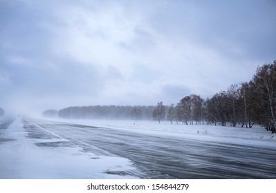 Winter Road In Snow Forest