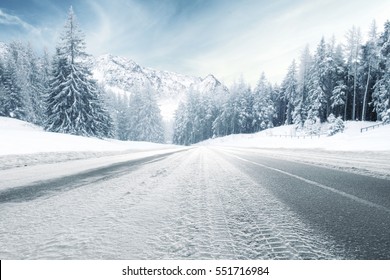 Winter Road And Trees With Snow And Alps Landscape 