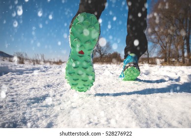 Winter Running Exercise. Runner Jogging In Snow. 