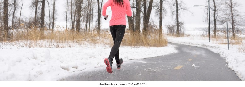 Winter Running Shoes On Ice And Snow. Banner Crop Of Slippery Road. Athlete Runner Training Outside In Cold Weather.