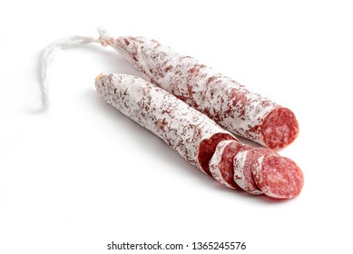Winter salami stick and slices on white background. Famous Hungarian food.