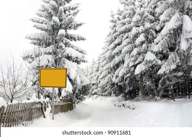 Winter Scene With Blank Road Sign