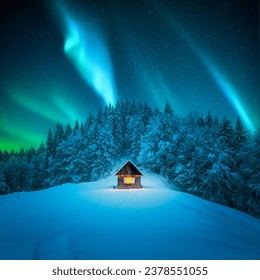 A winter scene with a solitary wooden cabin and snow-covered fir trees. Aurora borealis. Northern lights in winter forest. Christmas holiday and winter vacations concept - Powered by Shutterstock