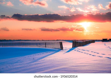 Winter Scene Under Color Sky At Sunset On Snow Covered Beach. Jones Beach State Park., Long Island NY