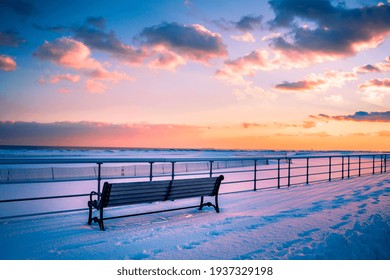 Winter Scene Under Color Sky At Sunset On Snow Covered Beach. Jones Beach State Park., Long Island NY