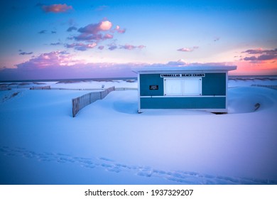 Winter Scene Under Color Sky At Sunset On Snow Covered Beach. Jones Beach State Park., Long Island NY