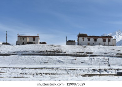 A Winter Scenery, Local House Of Zanskar, A Prayer Flag Post And Prayers  Near The House And On The Rooftop Signifies That It A Buddhist Family House.