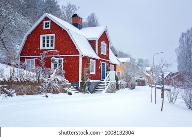 Winter Scenery With Red Wooden House In Sweden