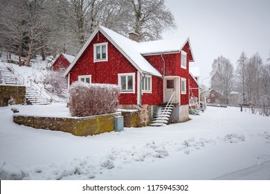 Winter Scenery With Red Wooden House In Sweden