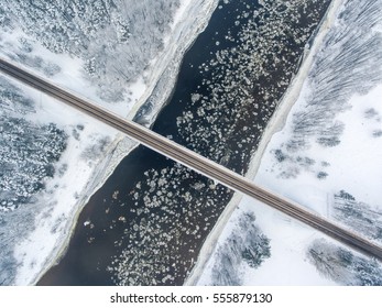 Winter Season Aerial Top Down View Of A Bridge With A Straight Line Road Over River Nemunas.