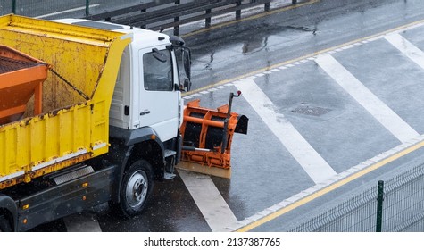 Winter Service Vehicle Clears Snow Covered Roads