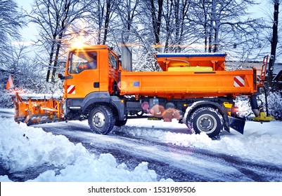 Winter Service Vehicle Snow Plow Clearing Side Street In Morning Light