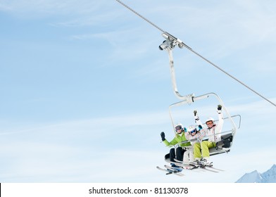 Winter - Ski Vacation - Family On Ski Lift - Space For Text