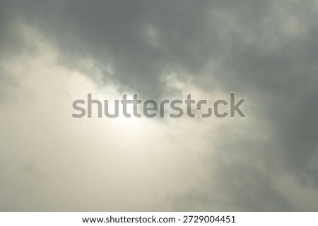 A winter sky with diffused sunlight and clouds