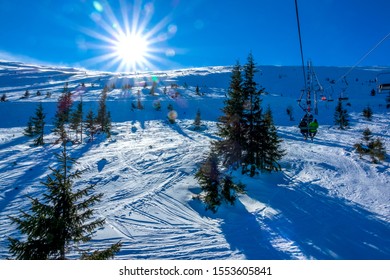 Winter Slovakia. Ski Resort Jasna. Bright Sun Over An Unequipped Ski Slope. View From The Chair Lift