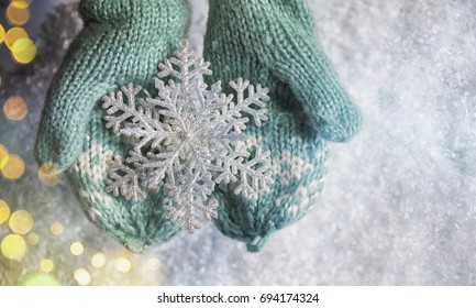 Winter Snow Background, Kids Hands Holding Christmas Ornament