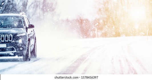Winter, snow, Blizzard, poor visibility on the road. Car during a Blizzard on the road with the headlights
